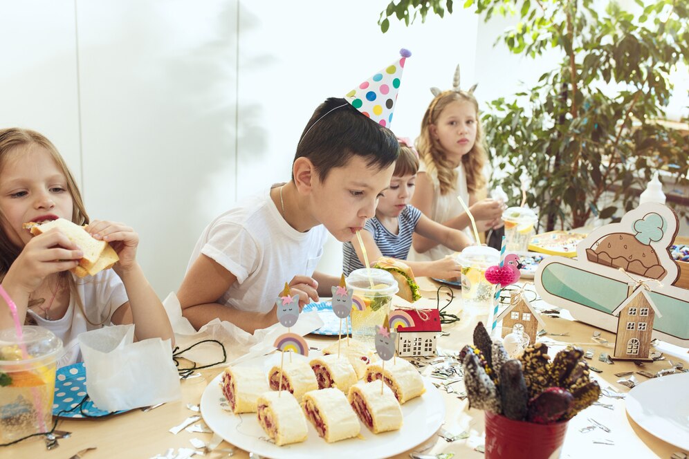 group of children eating delicious snacks